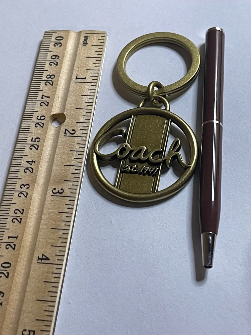 Coach Gold-Tone Circular Logo Keyring and Coach Pen